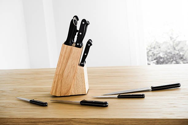 Set of kitchen knife on wooden table